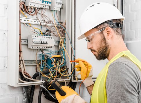 electrician checking electric panel