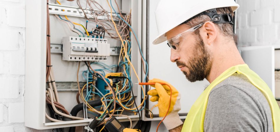 electrician checking electric panel