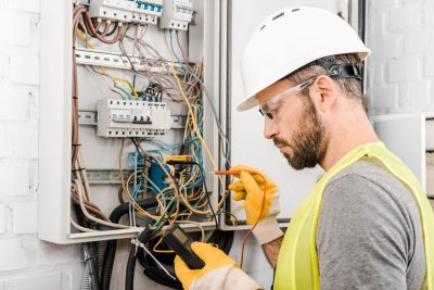 electrician checking electric panel