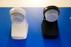 Two solar energy lapms. Blue table surface.